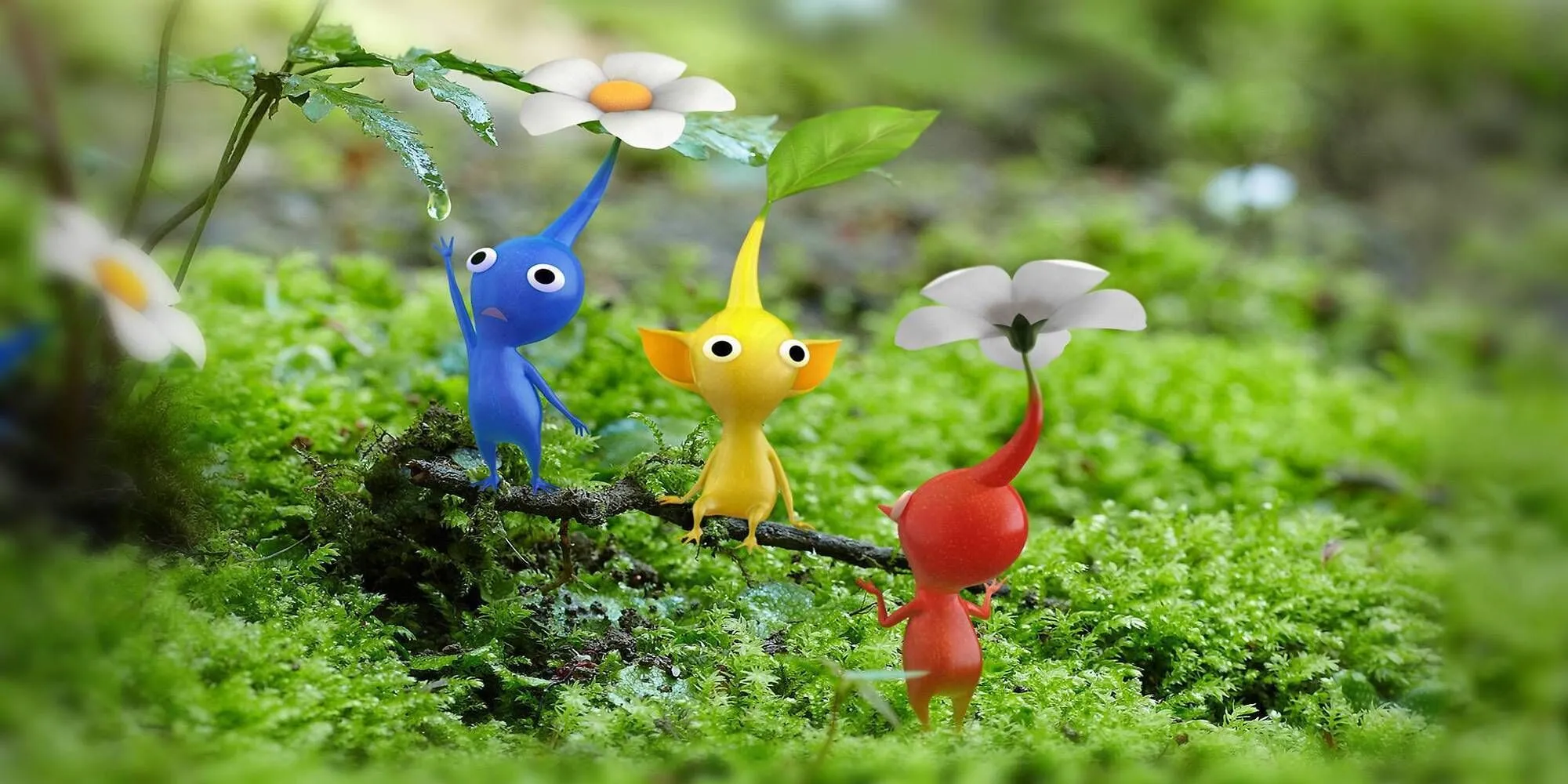 Các Pikmin nhiều màu sắc (đỏ, vàng, xanh) đậu trên cành cây phủ rêu trong Pikmin 3 Deluxe