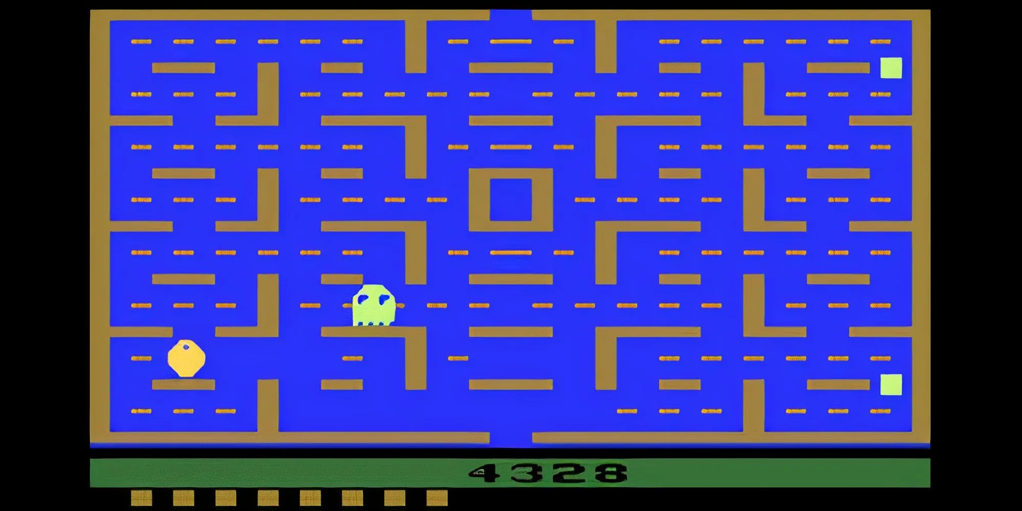 Giao diện và lối chơi của game Pac-Man trên hệ máy Atari 2600