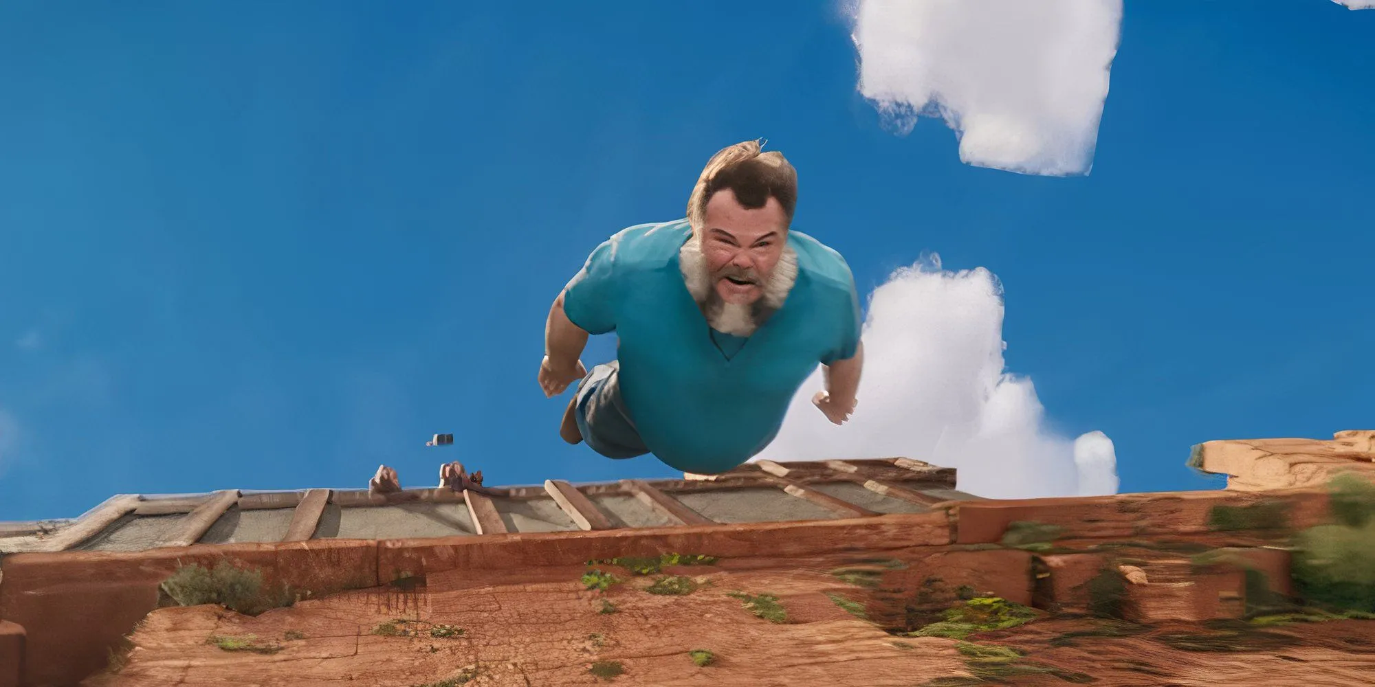 Jack Black, trong vai Steve, đang rơi xuống trong phim A Minecraft Movie.