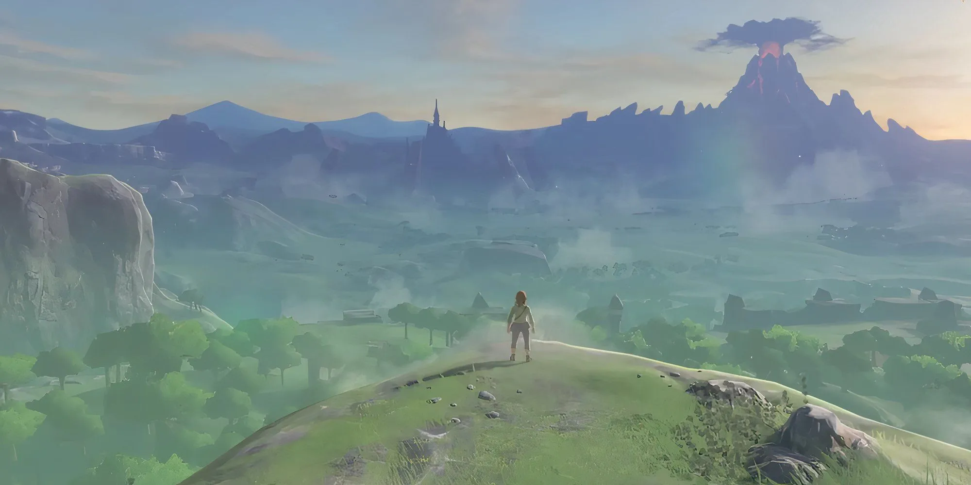 Link trong Zelda Breath of the Wild đứng trên vách đá nhìn ra Hyrule