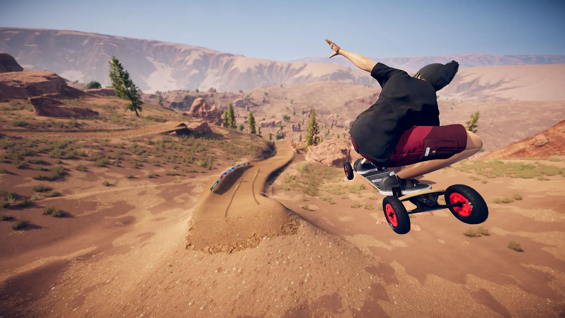 Một cảnh đua xe địa hình trong game Descenders Next với tay đua đang thực hiện cú nhảy qua khe núi hiểm trở