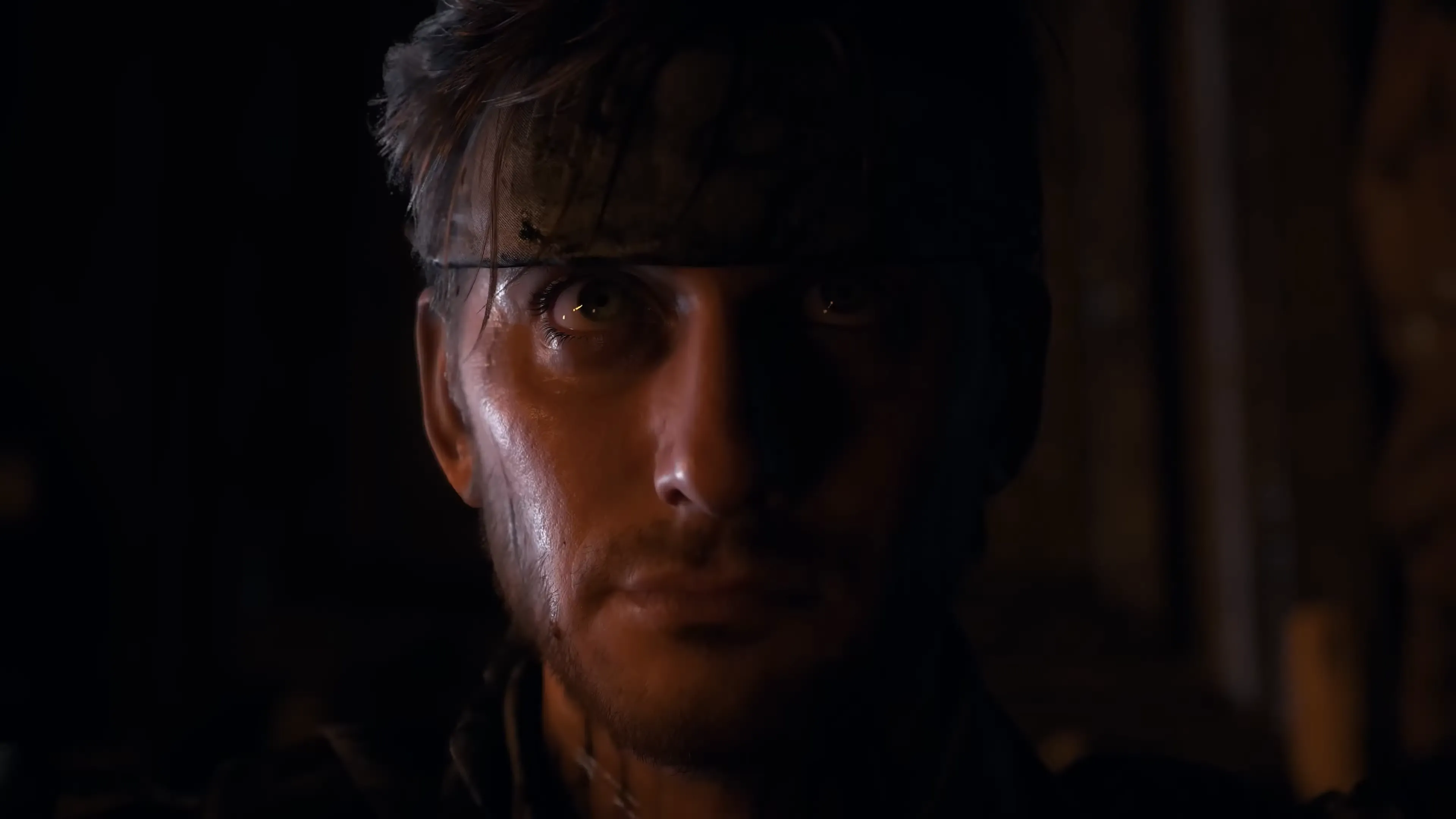 Nhân vật Sam Porter Bridges trong Death Stranding 2 On The Beach với khung cảnh núi non hùng vĩ