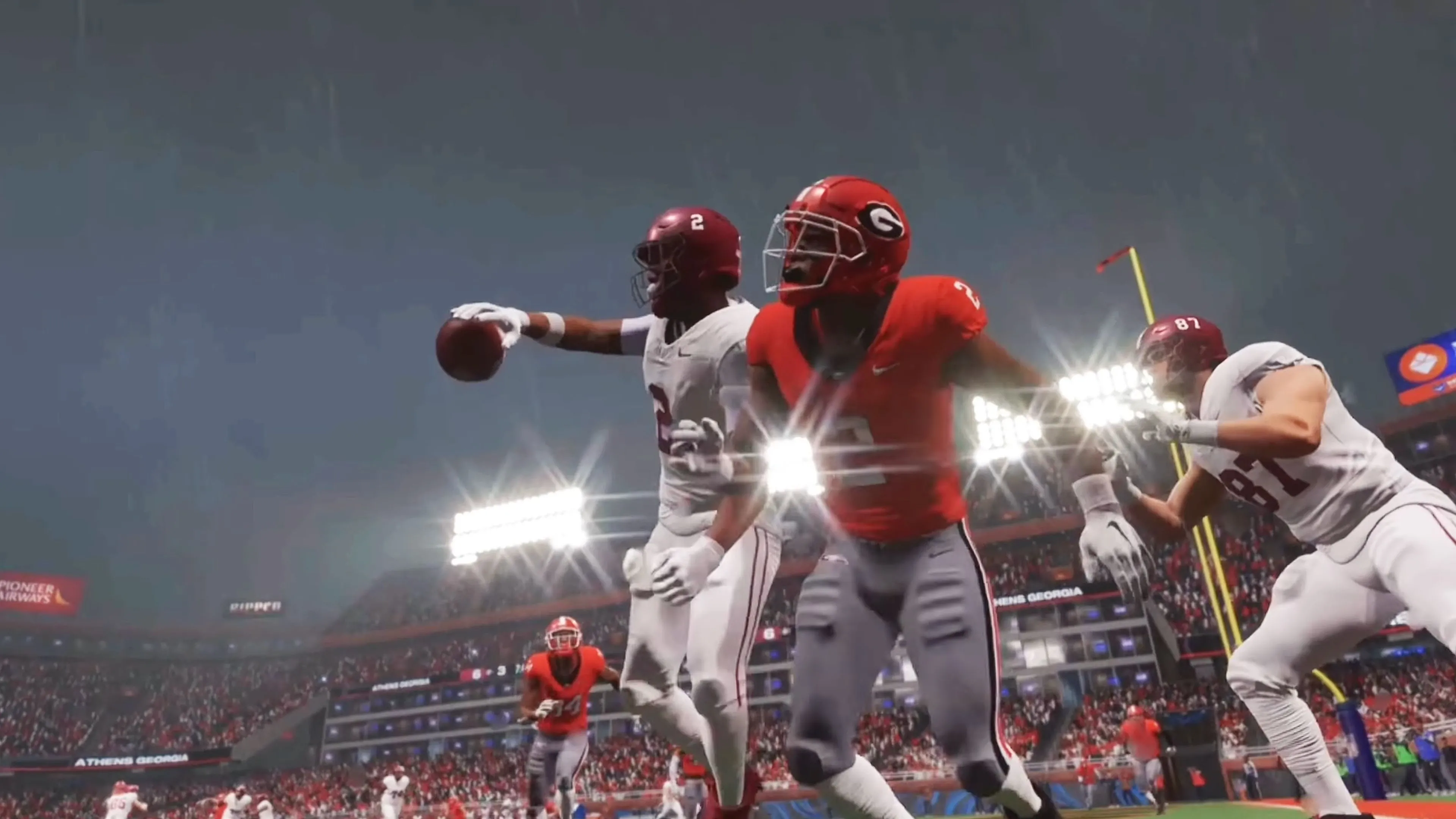 Cầu thủ đang chạy vượt qua hậu vệ trong College Football 26
