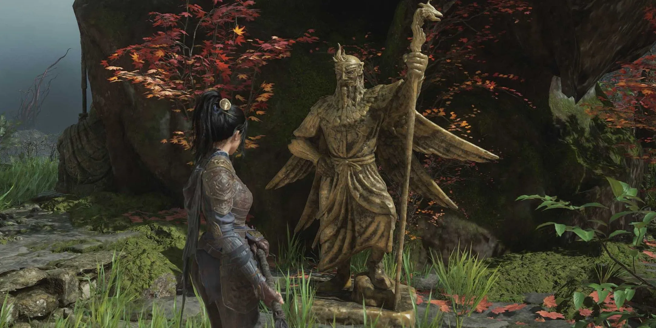 Wuchang đứng trước một bức tượng vàng khổng lồ tại Shu Sanctum, nơi có thể loại bỏ Madness